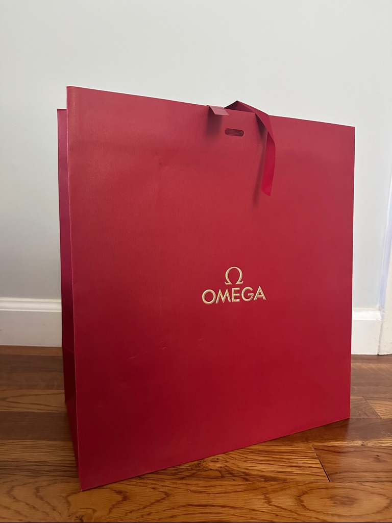 Omega Red Gift Bag With Gold Logo